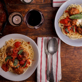 Baked lamb meatballs with spaghetti and a herb infused tomato sauce
