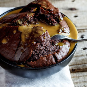 Warm chocolate pudding with coffee-cream sauce