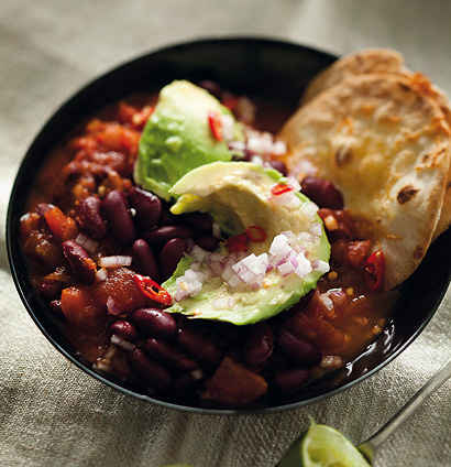 Spicy Mexican red kidney bean soup with chunky guacamole