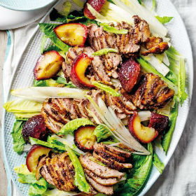 Roast spiced plums and duck with chicory and cos