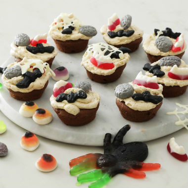 Chocolate and pumpkin cupcakes with spiced spider web frosting