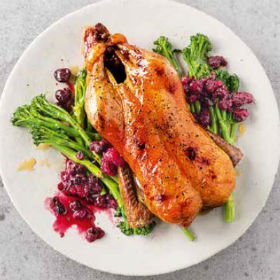 Honey roast duck with a mulled wine cherry sauce