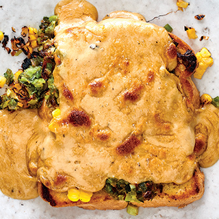 Welsh rarebit on toast with corn and leeks
