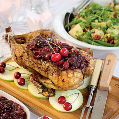 Whole roast duck with cherry, cinnamon and nutmeg sauce